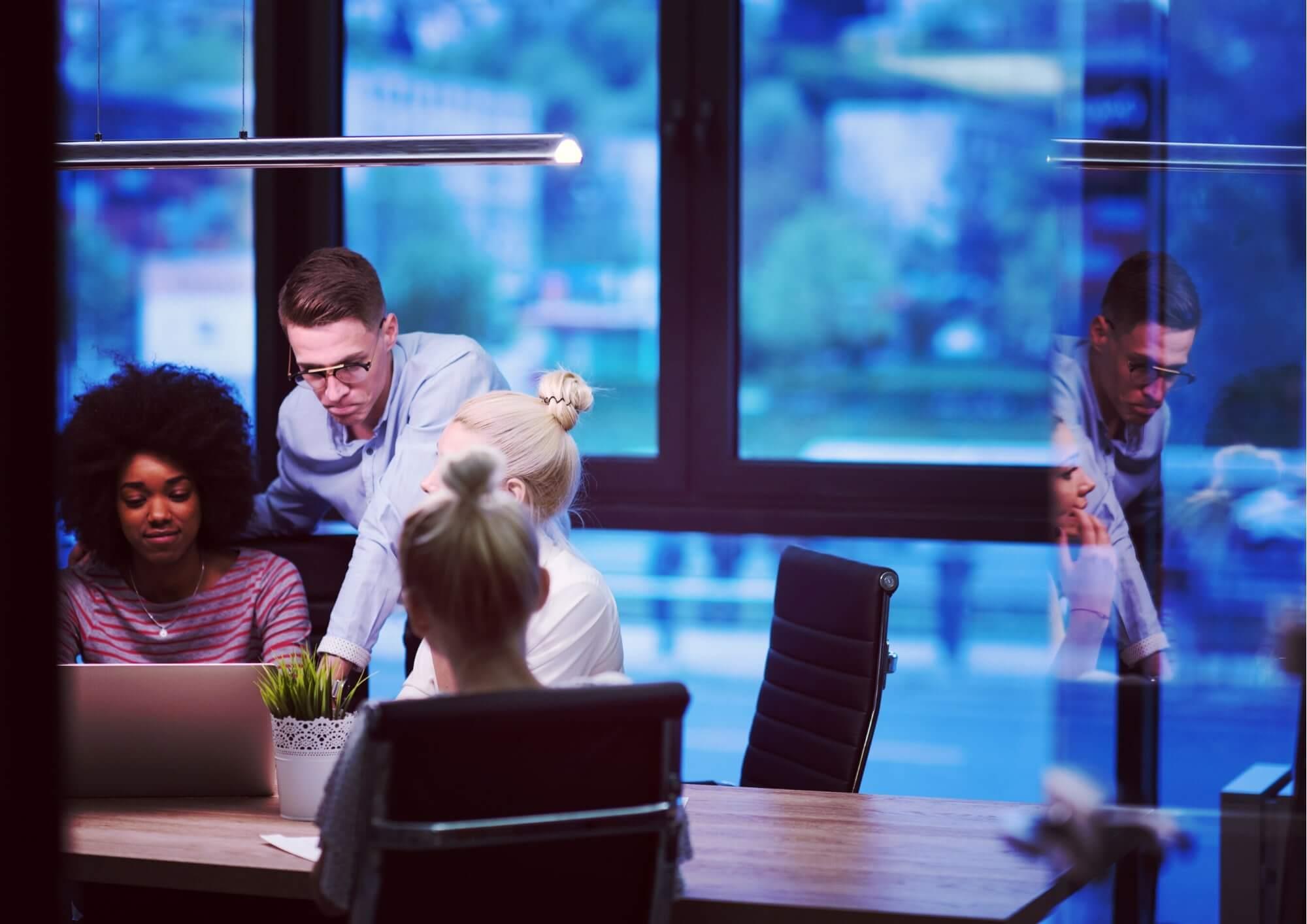 4 people in a boardroom