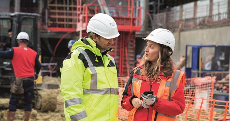 Female Account Manager with Customer on Jobsite