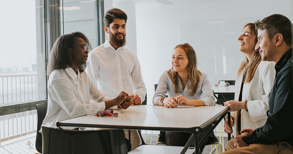 Team in Conversation at Table