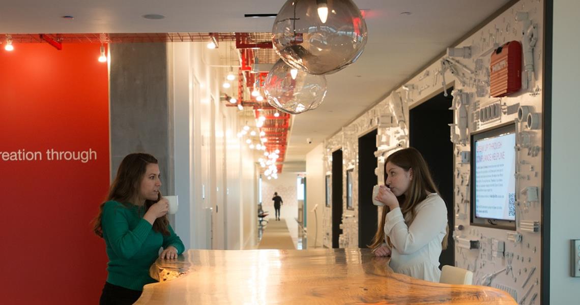 Plano Female Employees Chatting Coffee Environement