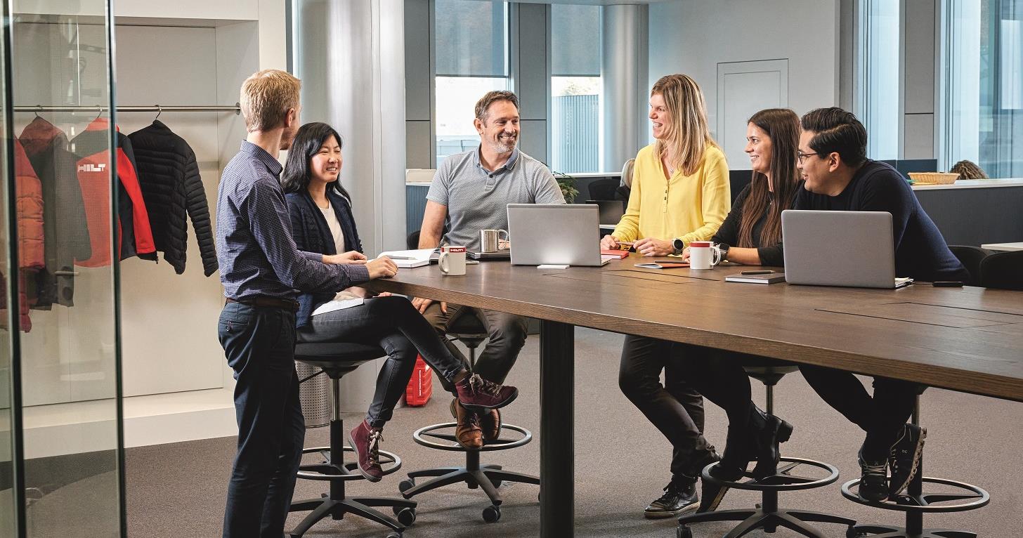 Diverse Group Discussing at a Table