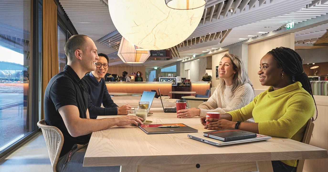 Diverse Team Drinking Coffee Together in Cafe